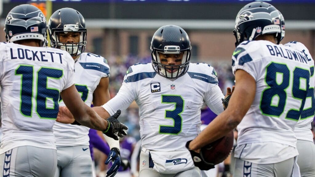 Dec 6, 2015; Minneapolis, MN, USA; Seattle Seahawks quarterback Russell Wilson (3) celebrates with teammates during the third quarter against the Minnesota Vikings at TCF Bank Stadium. The Seahawks defeated the Vikings 38-7.