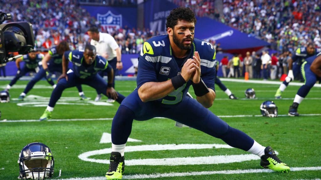 Feb 1, 2015; Glendale, AZ, USA; Seattle Seahawks quarterback Russell Wilson (3) stretches prior to the game against the New England Patriots in Super Bowl XLIX at University of Phoenix Stadium.