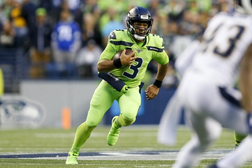 Oct 3, 2019; Seattle, WA, USA; Seattle Seahawks quarterback Russell Wilson (3) rushes against the Los Angeles Rams during the second quarter at CenturyLink Field.