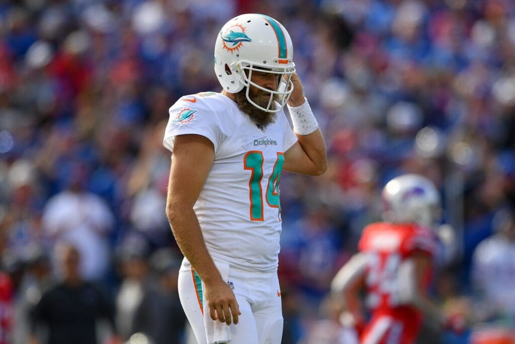 Oct 20, 2019; Orchard Park, NY, USA; Miami Dolphins quarterback Ryan Fitzpatrick (14) reacts while walking off the field following his interception against the Buffalo Bills during the third quarter at New Era Field.