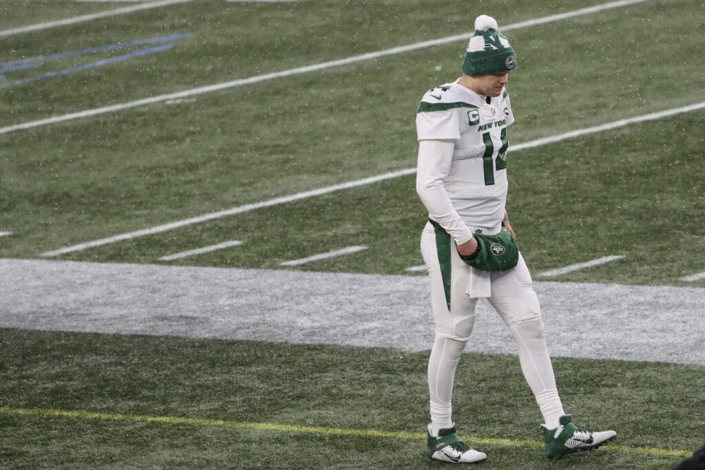 Jan 3, 2021; Foxborough, Massachusetts, USA; New York Jets quarterback Sam Darnold (14) walks alone on the sidelines during the second half of their loss to the New England Patriots at Gillette Stadium.