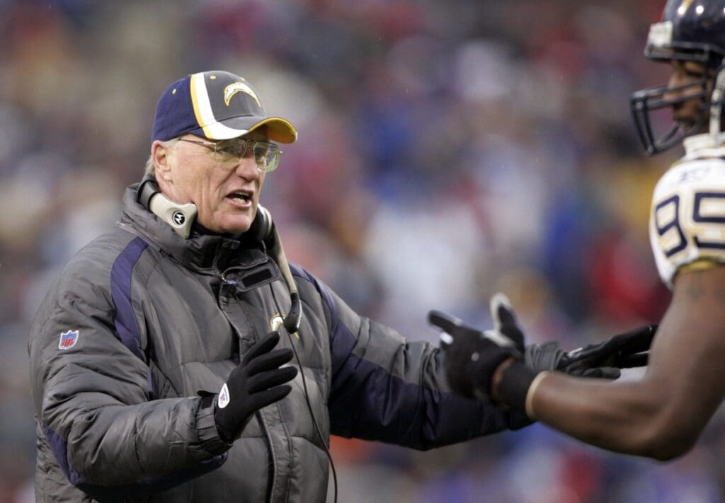 Dec 3, 2006; Orchard Park, NY, USA; San Diego Chargers head coach Marty Schottenheimer talks with linebacker (95) Shaun Phillips during the first quarter against the Buffalo Bills at Ralph Wilson Stadium.