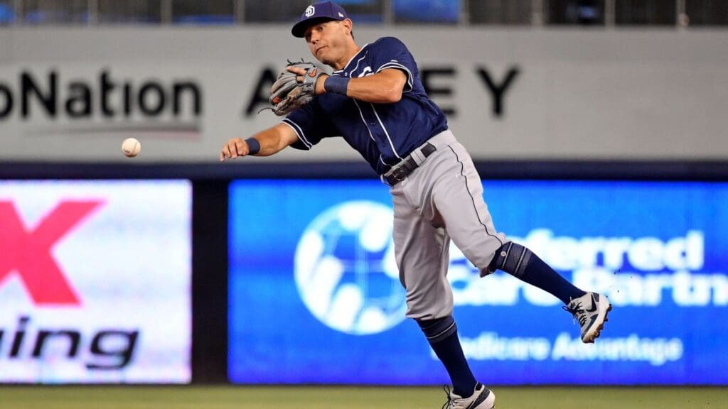 Jul 16, 2019; Miami, FL, USA; San Diego Padres second baseman Ian Kinsler (3) throws out a Miami Marlins base runner in the first inning at Marlins Park. 