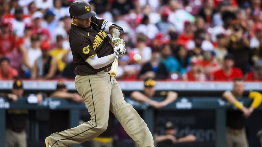 Jun 28, 2025; Cincinnati, Ohio, USA; San Diego Padres third baseman Manny Machado (13) hits a single in the eighth inning against the Cincinnati Reds at Great American Ball Park.