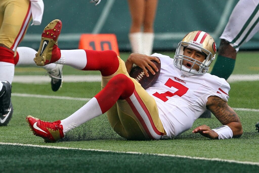 Sept 30, 2012; East Rutherford, NJ, USA; San Francisco 49ers quarterback Colin Kaepernick (7) slides on the 1 yard line during the second half at MetLIfe Stadium. The 49ers defeated the Jets 34-0.