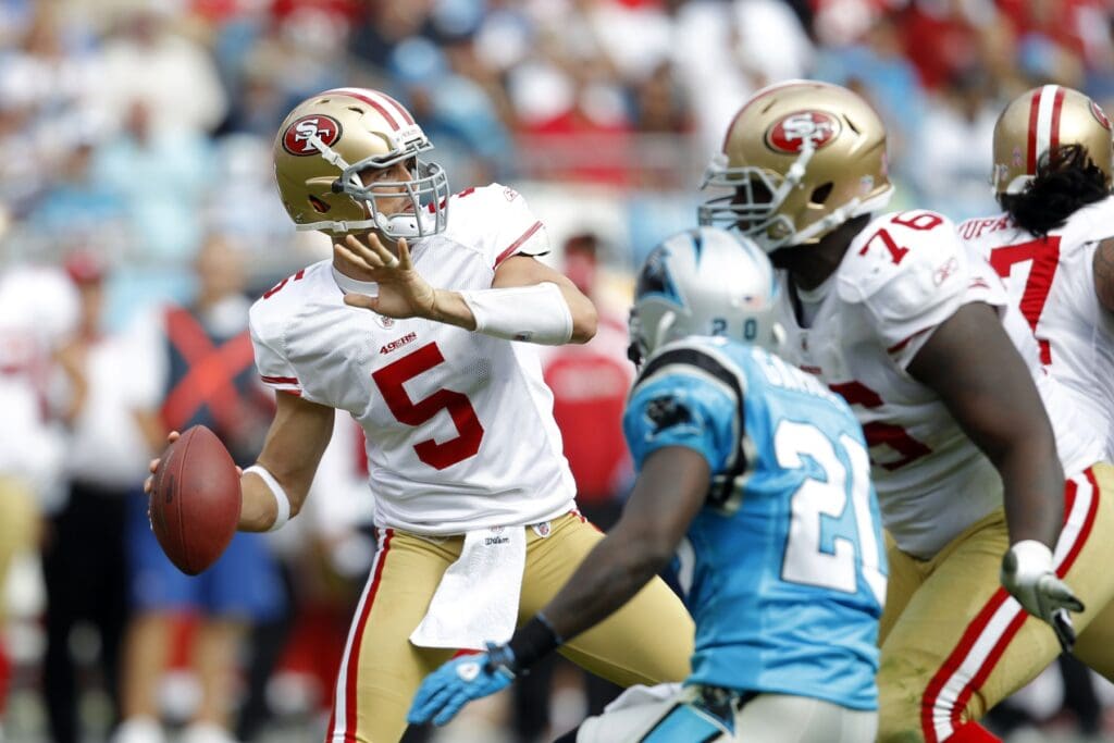 Oct, 24, 2010; Charlotte, NC, USA; San Francisco 49ers quarterback David Carr (5) looks to pass as Carolina Panthers cornerback Chris Gamble (20) defends. The Panthers defeated the 49ers 23-20 at Bank of America Stadium. 