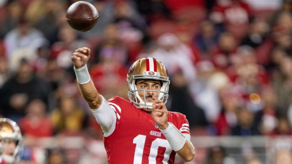 November 13, 2022; Santa Clara, California, USA; San Francisco 49ers quarterback Jimmy Garoppolo (10) passes the football against the Los Angeles Chargers during the third quarter at Levi's Stadium. 