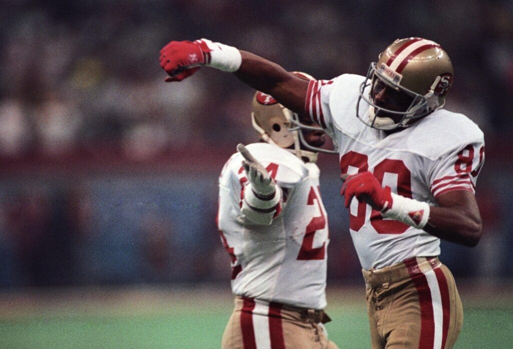 Jan 28, 1990; New Orleans, LA, USA; FILE PHOTO; San Francisco 49ers receiver Jerry Rice (80) reacts on the field against the Denver Broncos during Super Bowl XXIV at the Superdome. The 49ers defeated the Broncos 55-10.