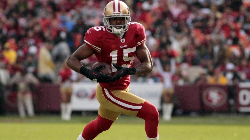 Nov 20, 2011; San Francisco, CA, USA; San Francisco 49ers wide receiver Michael Crabtree (15) runs with the ball after making a catch against the Arizona Cardinals in the second quarter at Candlestick Park.