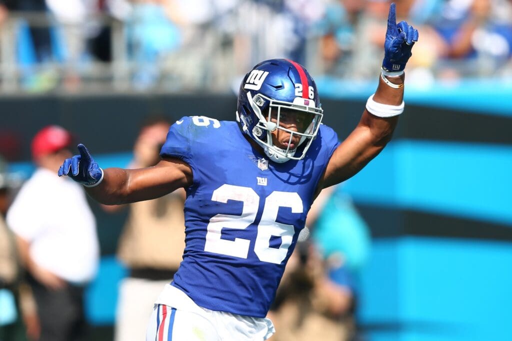 Oct 7, 2018; Charlotte, NC, USA; New York Giants running back Saquon Barkley (26) celebrates after scoring a touchdown in the second quarter against the Carolina Panthers at Bank of America Stadium.