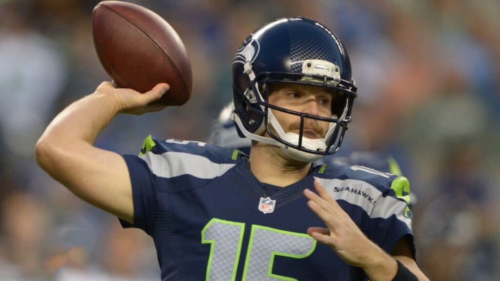 Aug 30, 2012; Seattle, WA, USA; Seattle Seahawks quarterback Matt Flynn (15) throws a pass against the Oakland Raiders at CenturyLink Field.