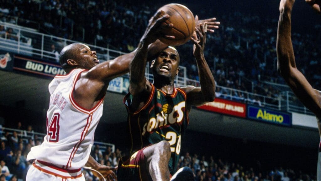 Feb 28, 1997; Miami, FL; USA; FILE PHOTO; Seattle Seattle Supersonics guard Gary Payton (20) attempts a shot against Miami Heat forward Jamal Mashburn (24) at the Miami Arena.