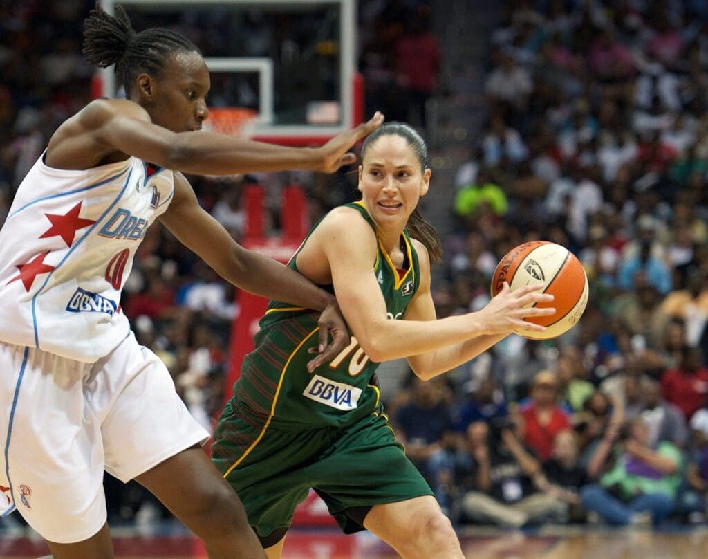 September 16, 2010; Atlanta, GA, USA; Seattle Storm guard Sue Bird (10) passes the ball past Atlanta Dream forward Sancho Lyttle (20) in the second half in game three of the WNBA Finals at Philips Arena. The Storm defeated the Dream 87-84 to win the series three games to none. 