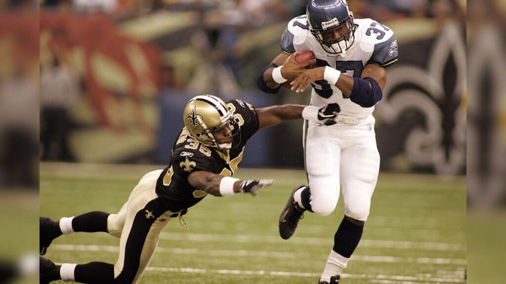 August 12, 2005; NEW ORLEANS, LA, USA; Seattle Seahawks running back Shaun Alexander (37) gets shoved out of bounds by New Orleans Saints Fakhir Brown (35) in 1st half action at the Louisiana Superdome.