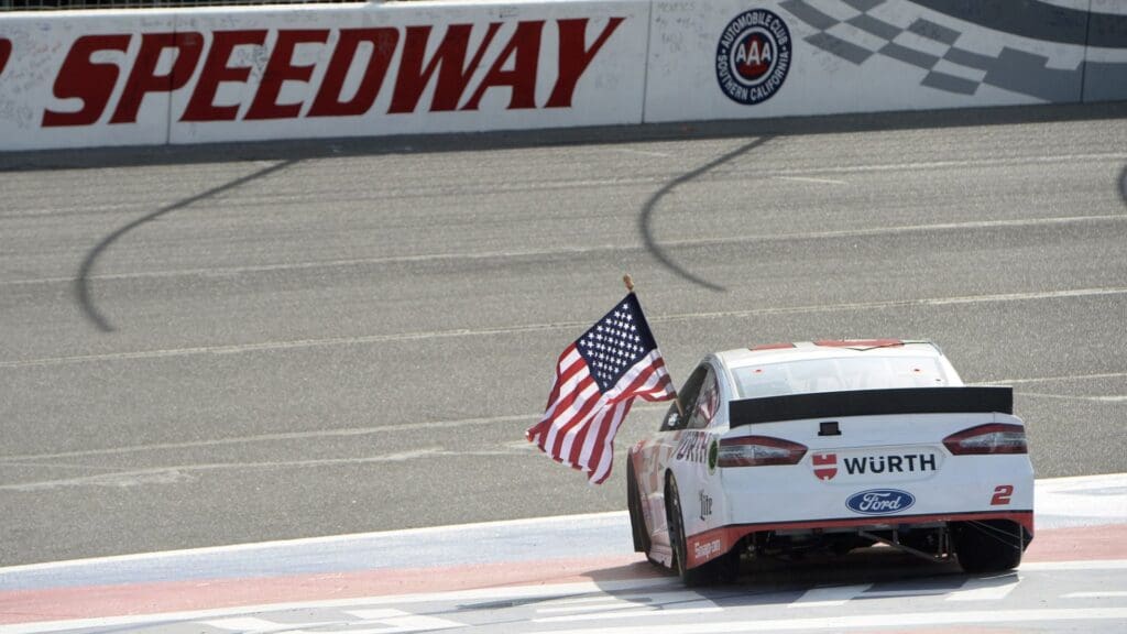 Mar 22, 2015; Fontana, CA, USA; Sprint Cup series driver Brad Keselowski celebrates his victory at the Auto Club 400 at Auto Club Speedway.