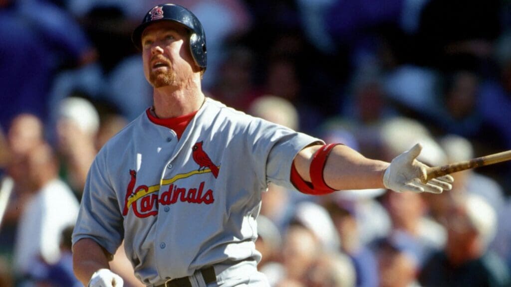 Aug 19, 1998; Chicago, IL, USA; FILE PHOTO; St. Louis Cardinals 1st baseman Mark McGwire hits his 48th home run of the season the first of two on the day against the Chicago Cubs at Wrigley Field.
