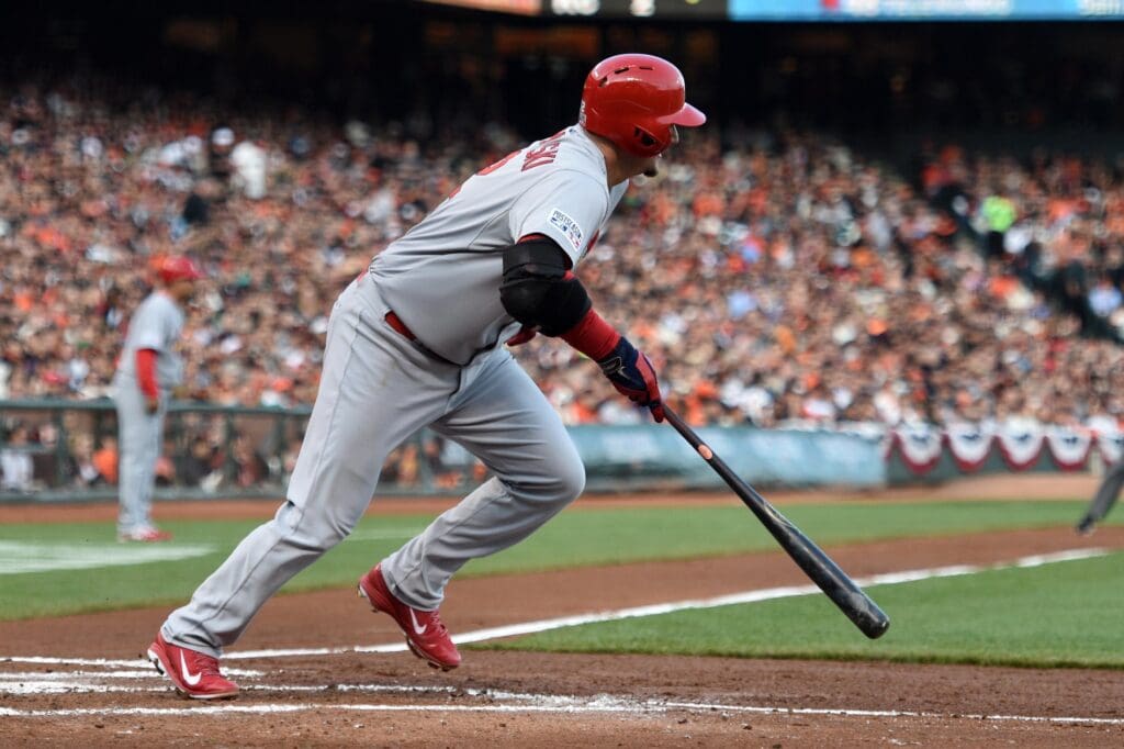 Oct 15, 2014; San Francisco, CA, USA; St. Louis Cardinals catcher A.J. Pierzynski (12) hits an RBI single during the second inning against the San Francisco Giants in game four of the 2014 NLCS playoff baseball game at AT&T Park.
