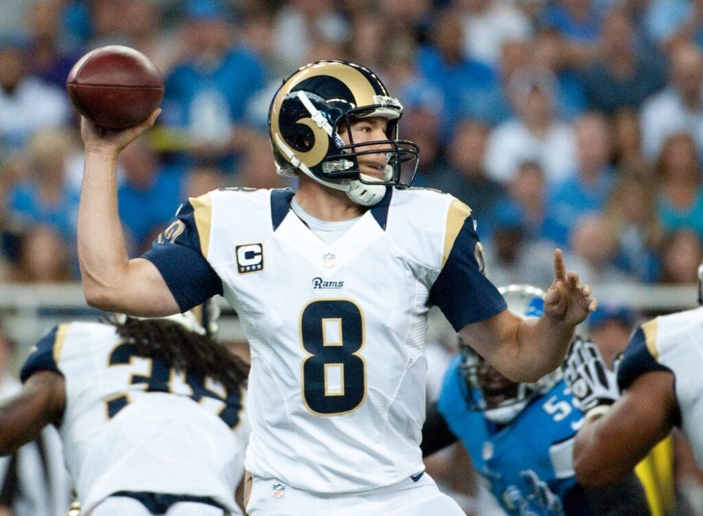Sep 9, 2012; Detroit, MI, USA; St. Louis Rams quarterback Sam Bradford (8) drops back to pass against the Detroit Lions during the third quarter at Ford Field.