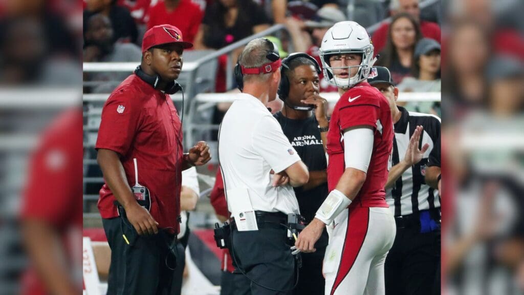 Arizona Cardinals quarterback Josh Rosen (3) talks with (from left) quarterbacks coach Byron Leftwich, offensive coordinator Mike McCoy and head coach Steve Wilks during a break against the Seattle Seahawks in the second quarter at State Farm Stadium in Glendale, Ariz. September 30, 2018. Sonics Vs Cardinals