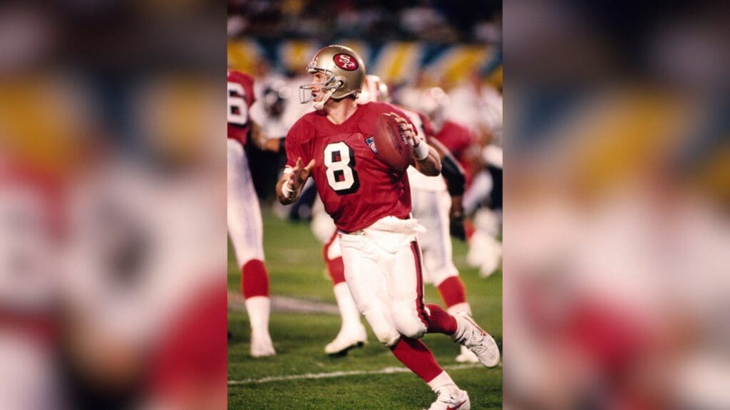 Jan 29, 1995; Miami, FL, USA; FILE PHOTO; San Francisco 49ers quarterback Steve Young (8) looks to throw against the San Diego Chargers during Super Bowl XXIX at Joe Robbie Stadium. The 49ers defeated the Chargers 49-26.
