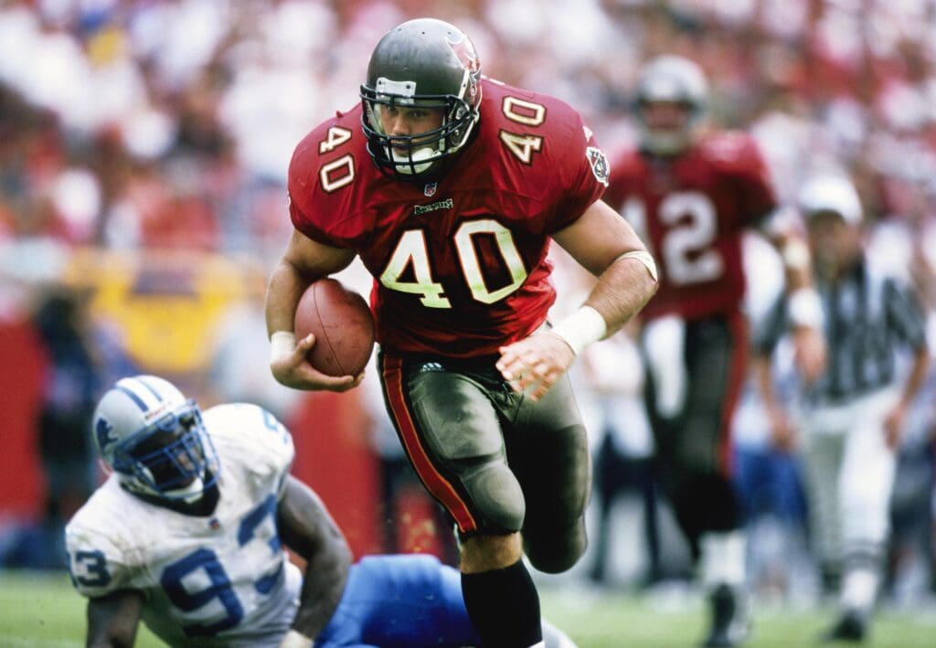 Nov 22, 1998; Tampa, FL, USA; Tampa Bay Buccaneers running back Mike Alstott (40) carries the ball against the Detroit Lions at Raymond James Stadium. 