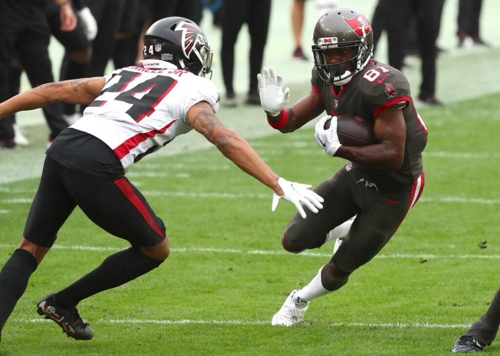 Jan 3, 2021; Tampa, Florida, USA; Tampa Bay Buccaneers wide receiver Antonio Brown (81) runs with the ball as Atlanta Falcons cornerback A.J. Terrell (24) attempted to defend during the second half at Raymond James Stadium. 