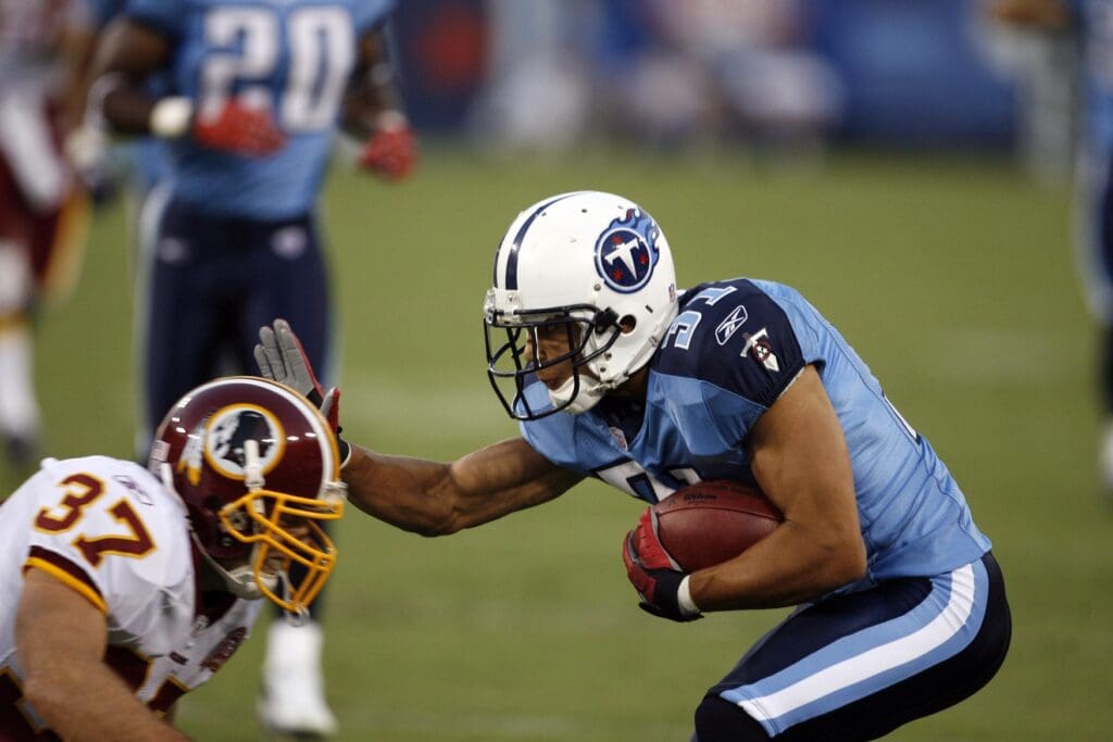 August 11, 2007; Nashville, TN, USA; Tennessee Titans corner back (31) Cortland Finnegan straight arms Washington Redskins safety (37) Reed Doughty on a punt return in the first quarter at LP Field.
