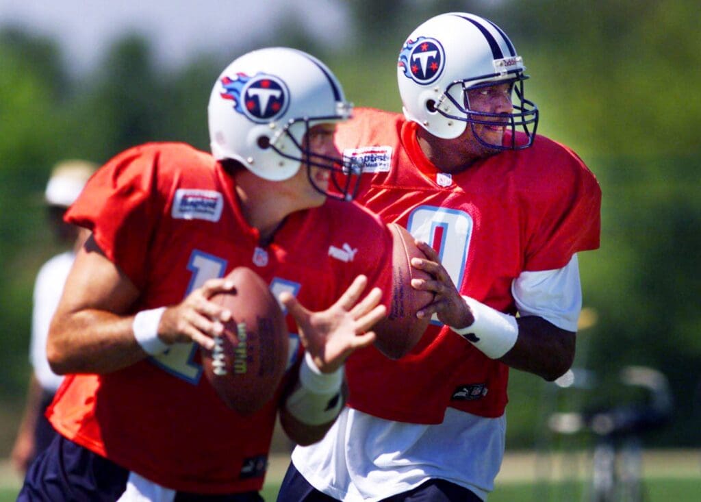 Tennessee Titans quarterbacks Neil O'Donnell, left, and Steve McNair get ready to fire during drills at practice Aug. 30, 1999. McNair, who will be the starter again, had his first full practice in more than two weeks as he fights off back problems. Tennessee Titans Neil O Donnell And Steve Mcnair In Training Camp