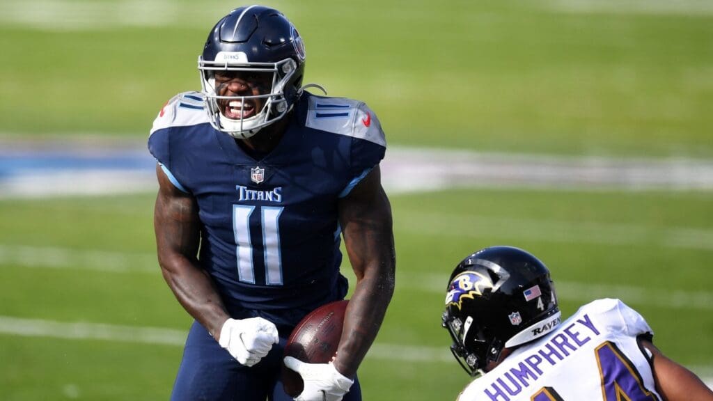 Jan 10, 2021; Nashville, Tennessee, USA; Tennessee Titans wide receiver A.J. Brown (11) reacts after a catch against the Baltimore Ravens during the first quarter in a AFC Wild Card playoff game at Nissan Stadium.