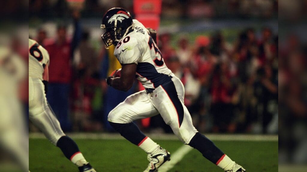 Jan 31, 1999; Miami, FL, USA; FILE PHOTO; Denver Broncos running back Terrell Davis (30) carries the ball against the Atlanta Falcons during Super Bowl XXXIII at Dolphin Stadium. The Broncos defeated the Falcons 34-19.