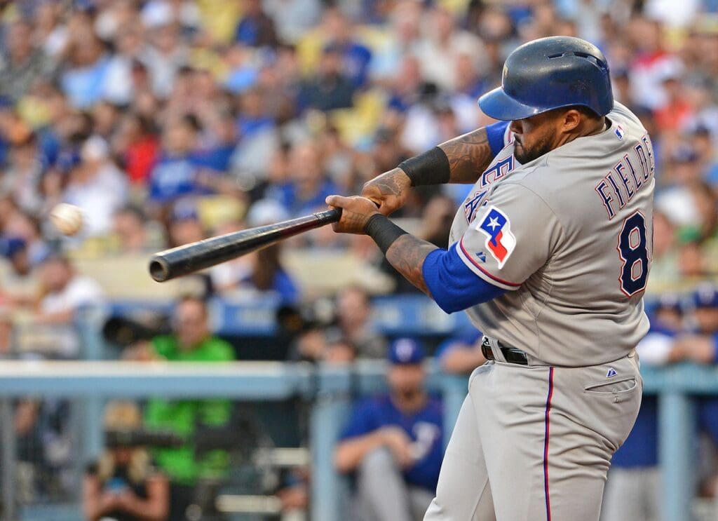 Jun 17, 2015; Los Angeles, CA, USA; Texas Rangers designated hitter Prince Fielder (84) doubles in the second inning of the game against the Los Angeles Dodgers at Dodger Stadium.