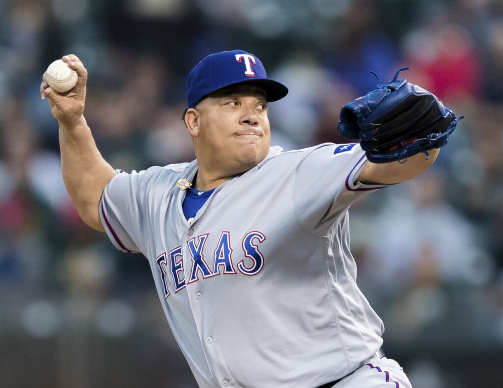 Aug 20, 2018; Oakland, CA, USA; Texas Rangers starting pitcher Bartolo Colon (40) delivers a pitch against the Oakland Athletics in the first inning at Oakland Coliseum. 