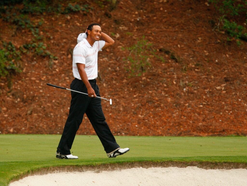 Tiger Woods acknowledges the gallery on 12 after catching his putter which he tossed in the air after missing his birdie putt attempt on No 12 during third round action of The 72nd Masters at Augusta National Golf Club on April 12, 2008.