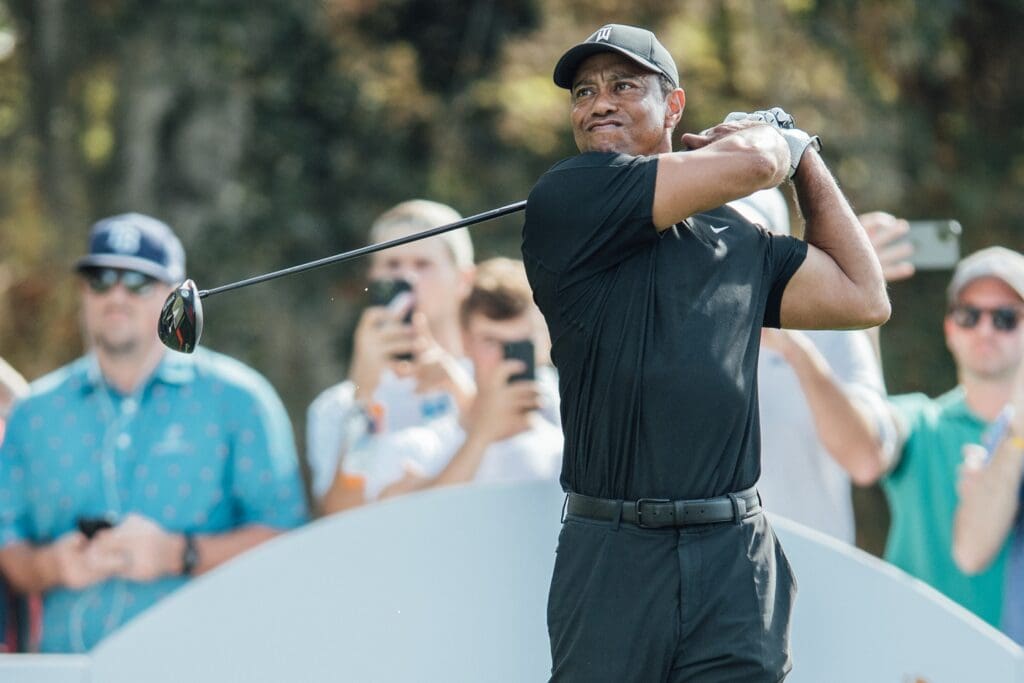 Dec 17, 2021; Orlando, Florida, USA; Tiger Woods plays his tee shot on the 11th hole during a pro-am round of the PNC Championship golf tournament at Grande Lakes Orlando Course. 