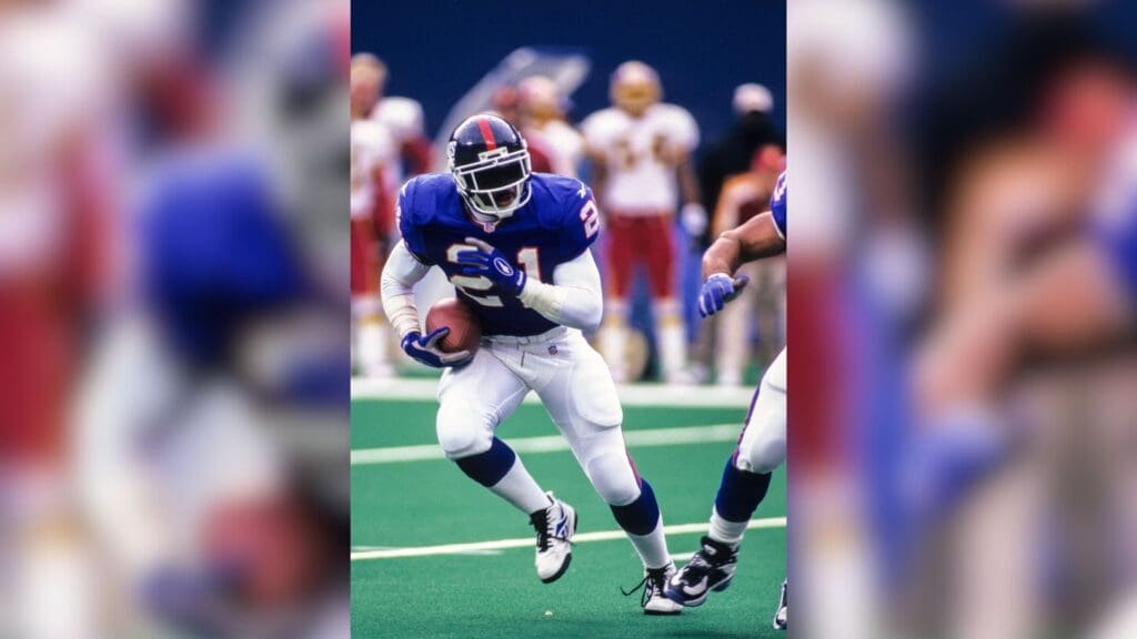 Dec 13, 1997; East Rutherford, NJ, USA; FILE PHOTO; New York Giants running back Tiki Barber (21) in action against the Washington Redskins at Giants Stadium.