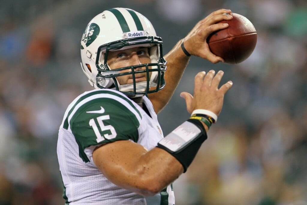 Aug 26, 2012; East Rutherford, NJ, USA; New York Jets quarterback Tim Tebow (15) throws a pass during warmups for their game against the Carolina Panthers at MetLife Stadium.
