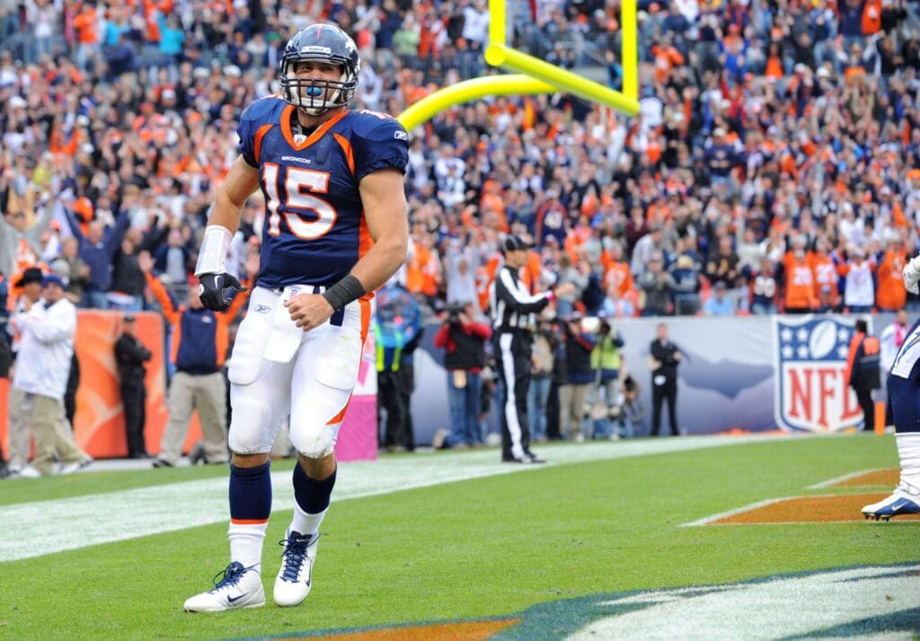 Oct 9, 2011; Denver, CO, USA; Denver Broncos quarterback Tim Tebow (15) celebrates his rushing touchdown during the fourth quarter against the San Diego Chargers at Sports Authority Field. The Chargers defeated the Broncos, 29-24.