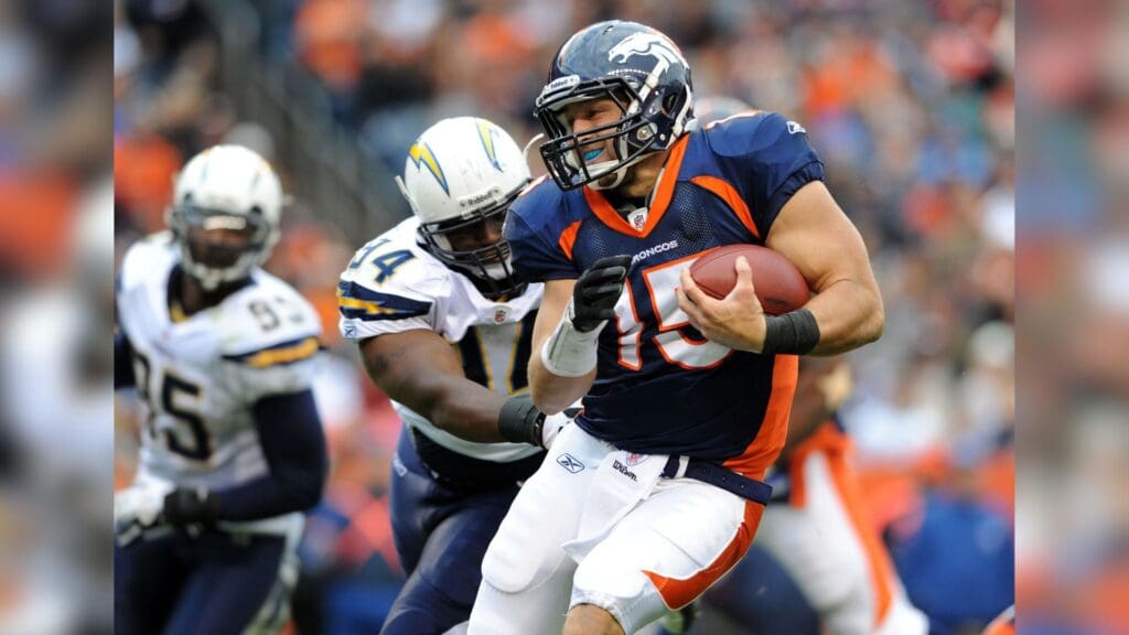 Oct 9, 2011; Denver, CO, USA; Denver Broncos quarterback Tim Tebow (15) runs with the football during the fourth quarter against the San Diego Chargers at Sports Authority Field. The Chargers defeated the Broncos, 29-24