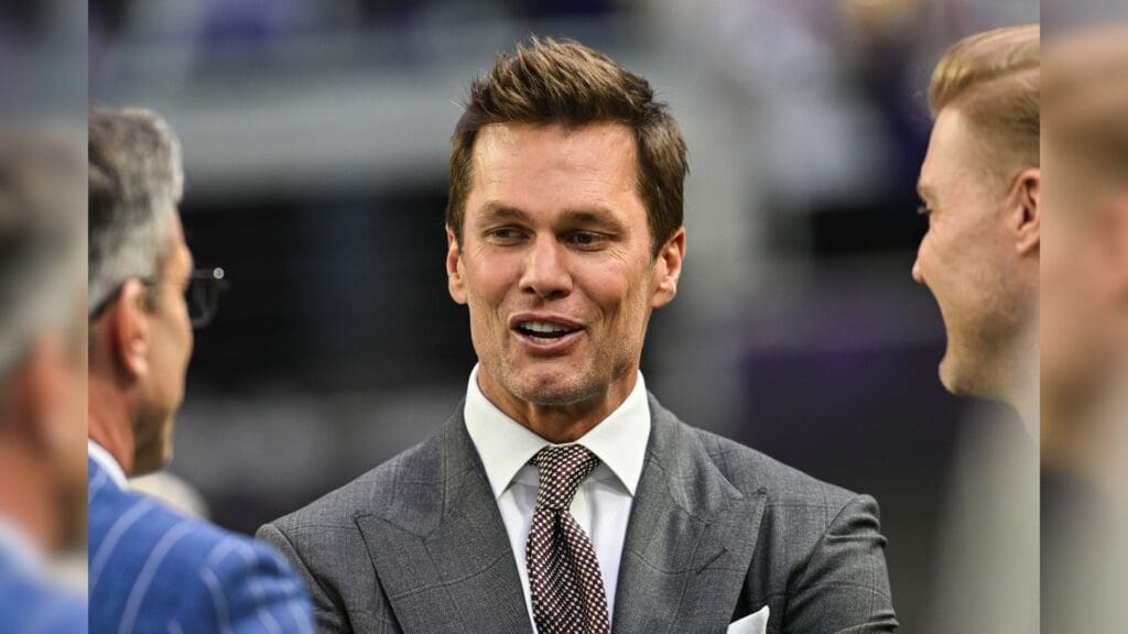 Dec 29, 2024; Minneapolis, Minnesota, USA; FOX broadcaster and former NFL quarterback Tom Brady looks on before the game between the Minnesota Vikings and the Green Bay Packers at U.S. Bank Stadium.