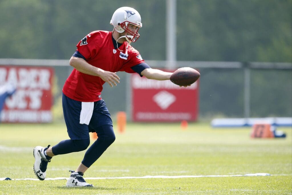 May 21, 2013; Foxborough, MA, USA; New England Patriots quarterback Tom Brady (12) on the practice field during organized team activities at Gillette Stadium.