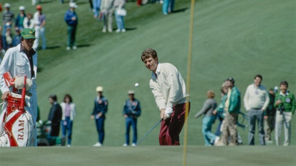 04/09/1985; Augusta, Georgia, USA; Tom Watson chips onto green with caddie watching at the Augusta National Golf Course during the 1985 Masters. 