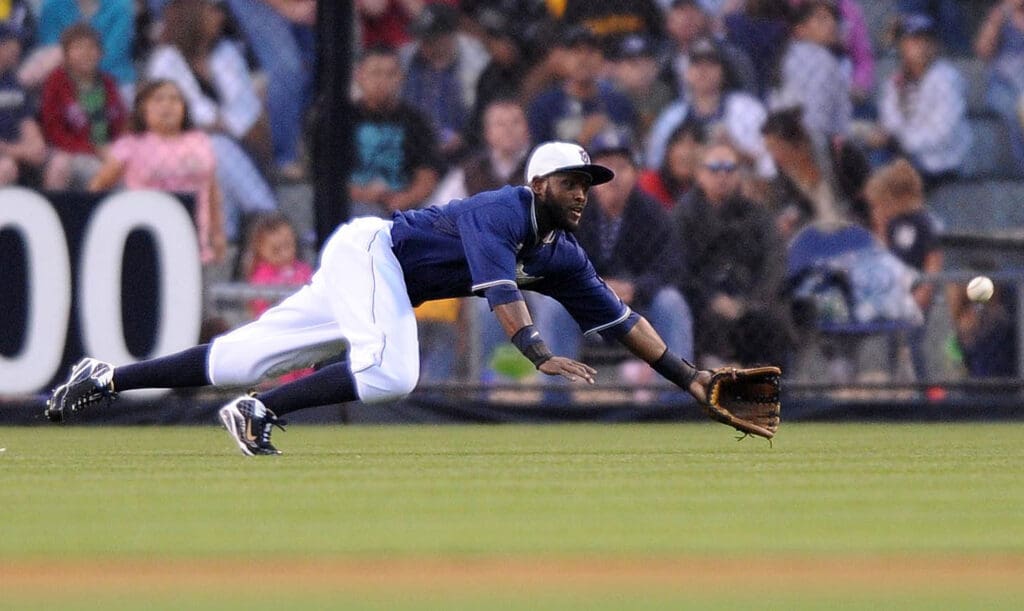 July 2, 2010; San Diego, CA, USA; San Diego Padres center fielder Tony Gwynn (18) dives for a ball but fails to make the catch during the fourth inning against the Houston Astros at Petco Park.