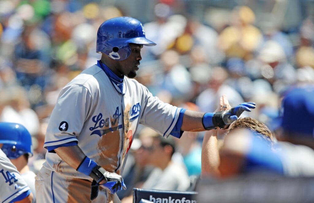 April 10, 2011; San Diego, CA, USA; Los Angeles Dodgers left fielder Tony Gwynn (10) receives congratulations from teammates after scoring during the first inning at Petco Park.
