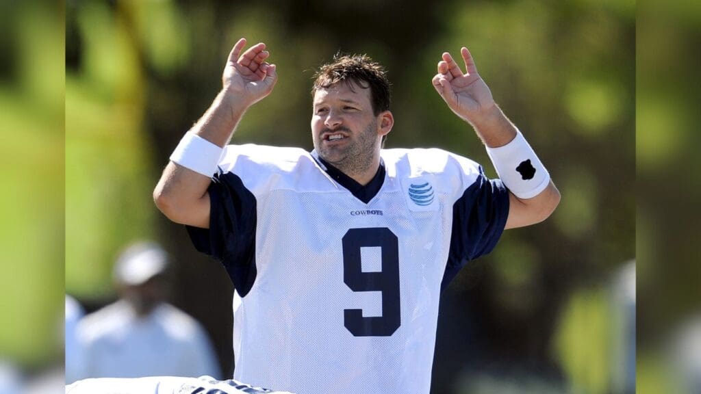 Jul 23, 2013; Oxnard, CA, USA; Dallas Cowboys quarterback Tony Romo (9) calls a play at training camp at the River Ridge Fields.