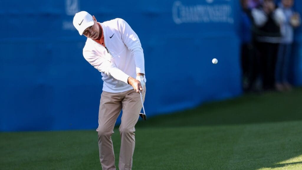Dec 21, 2024; Orlando, Florida, [USA]; Trevor Immelman hits a shot from the rough on the 18th hole during the PNC Championship at The Ritz-Carlton Golf Club. 