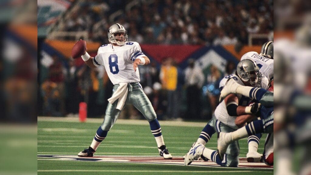 Jan 30, 1994; Atlanta, GA, USA; FILE PHOTO; Dallas Cowboys quarterback Troy Aikman (8) looks to throw against the Buffalo Bills during Super Bowl XXVIII at the Georgia Dome. Dallas defeated Buffalo 30-13.