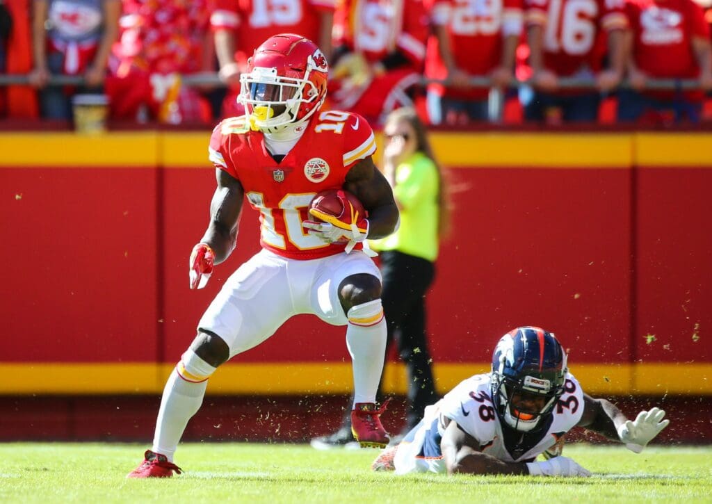 Oct 28, 2018; Kansas City, MO, USA; Kansas City Chiefs wide receiver Tyreek Hill (10) returns a punt as Denver Broncos safety Shamarko Thomas (38) defends in the first half at Arrowhead Stadium.