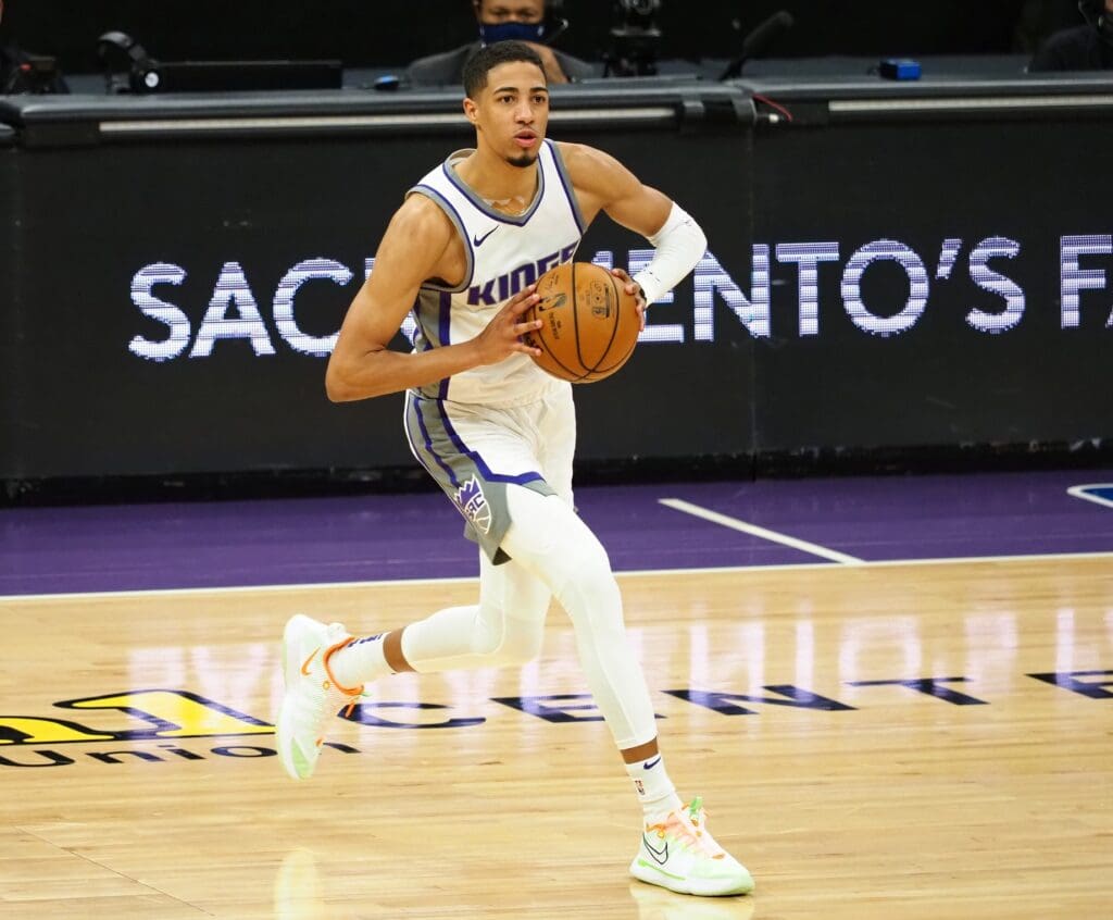 Jan 11, 2021; Sacramento, California, USA; Sacramento Kings guard Tyrese Haliburton (0) passes the ball against the Indiana Pacers during the third quarter at Golden 1 Center. 