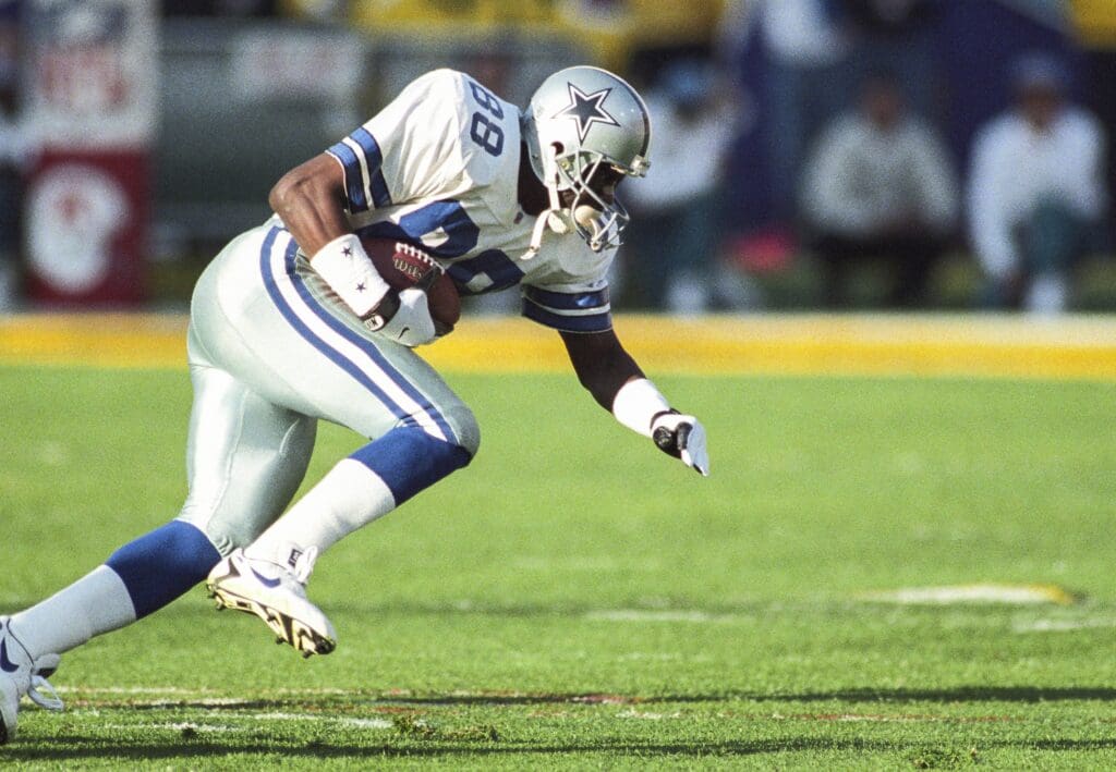 Jan 28, 1996; Tempe, AZ, USA; FILE PHOTO; Dallas Cowboys wide receiver Michael Irvin (88) carries the ball against the Pittsburgh Steelers during Super Bowl XXX at Sun Devil Stadium. The Cowboys defeated the Steelers 27-17. Mandatory Credit: Rob Schumacher/The Arizona Republic-USA TODAY Sports