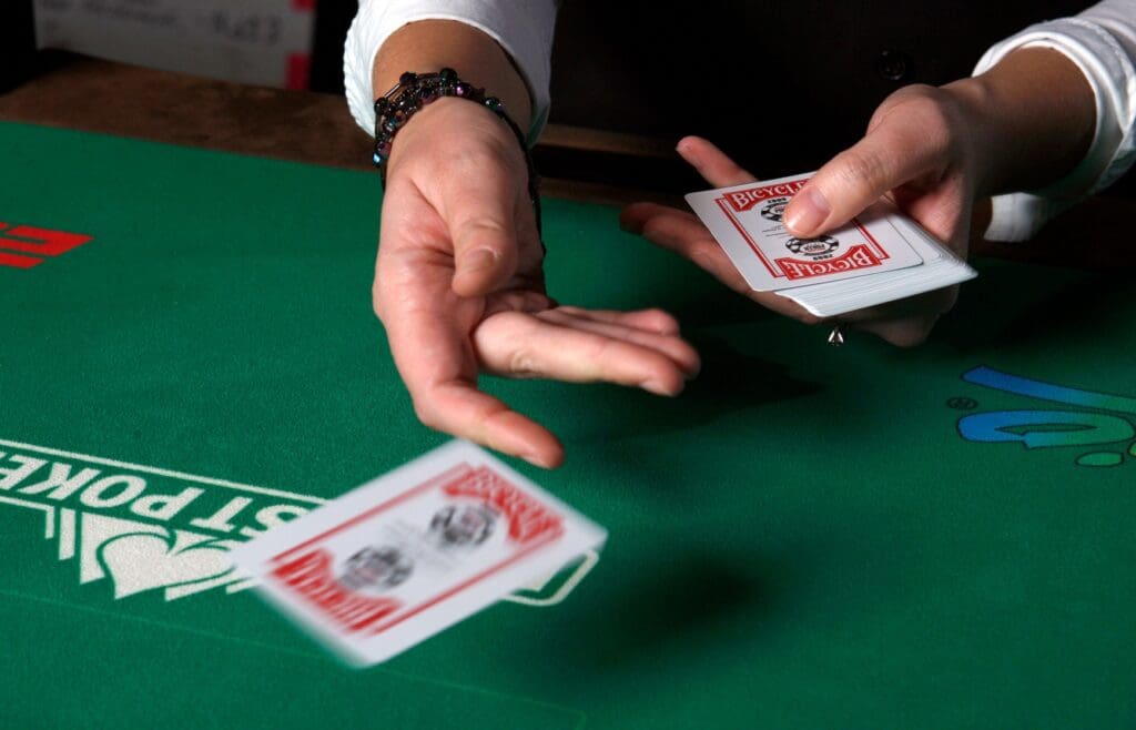 6/16/09 12:09:33 PM -- Las Vegas, NV, U.S.A --Dealer Sara Abdich, 26, tosses out a card during the World Series of Poker at the Rio hotel-casino in Las Vegas -- Photo by Steve Marcus, Freelance ORG XMIT: SM 36601 WSOP 6/16/2009 (Via MerlinFTP Drop)